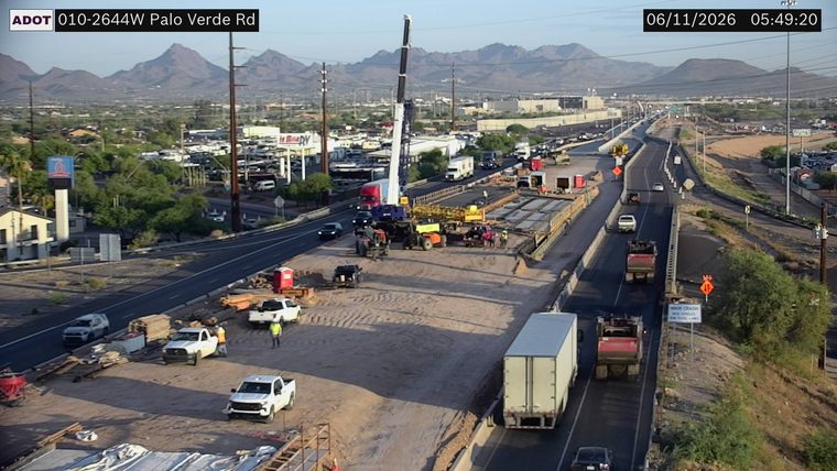 Construction activity with workers and equipment in the roadway