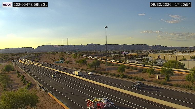 Fire truck and two vehicles on the right shoulder