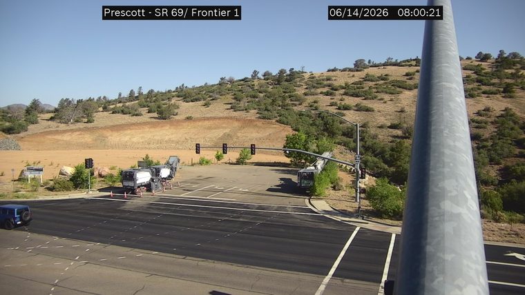Construction equipment and cones in the roadway