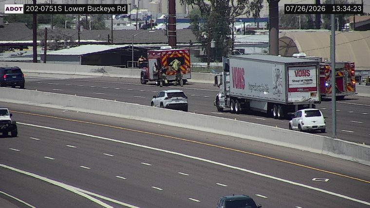 Fire truck and emergency personnel on the right shoulder