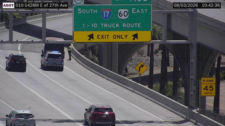 Police car with blue lights on the shoulder