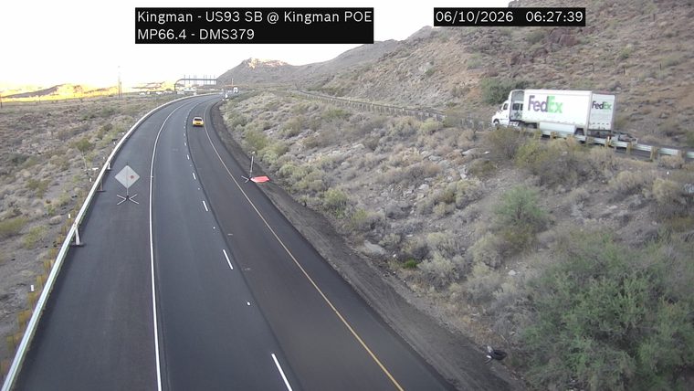 FedEx truck on the right shoulder