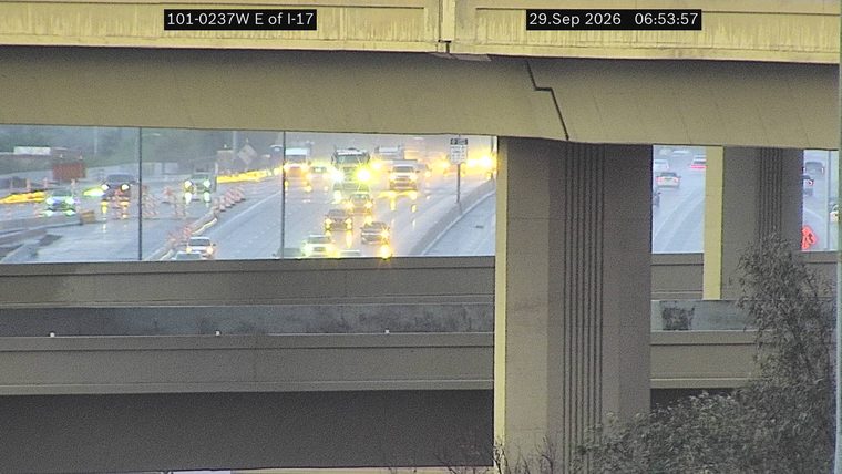 No incident — construction activity with cones and workers in the left lanes
