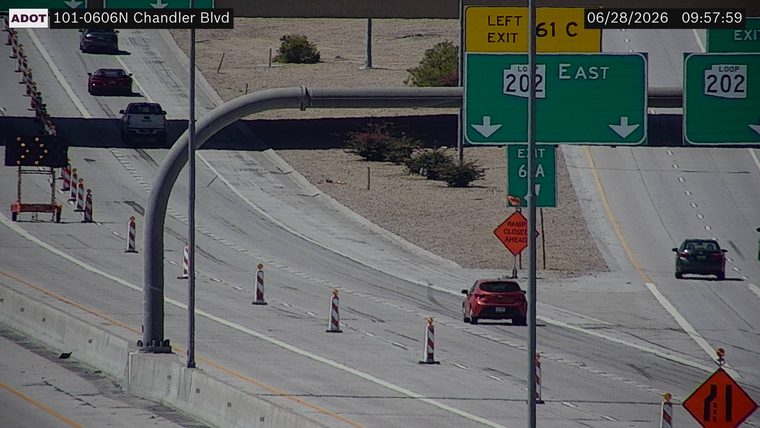 Construction cones and a ramp closed ahead sign in the right lane