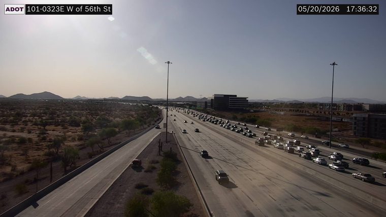 Red pickup truck on the right shoulder of the left-most roadway