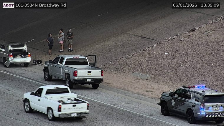 State Trooper vehicle with lights on in the right lane