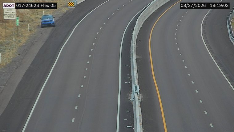 Blue SUV on the left shoulder