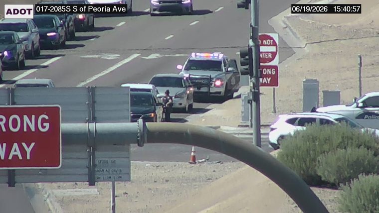 Police car with red and blue lights on the roadway