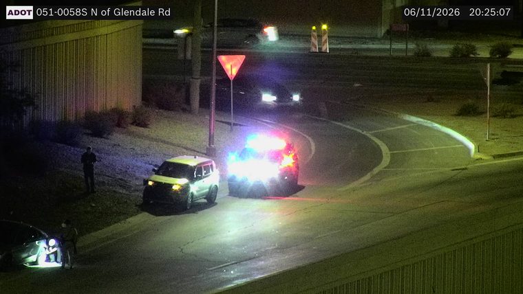 Police car with flashing lights on the roadway