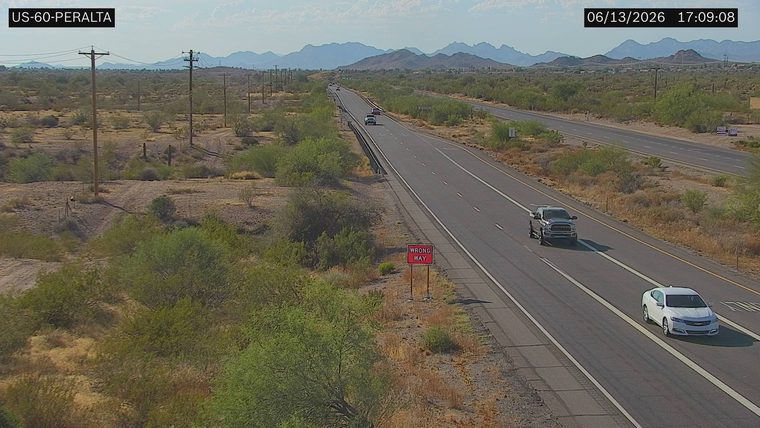 Wrong Way sign on the right side of the road