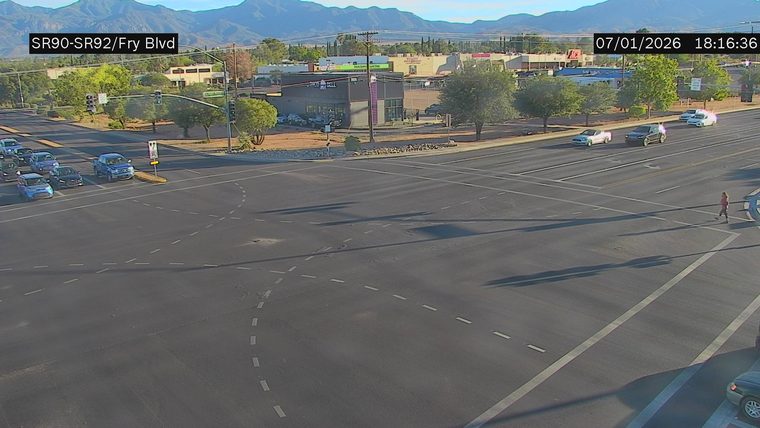 Person crossing the street in the right lane