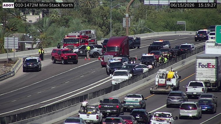 Multiple emergency vehicles and personnel in the roadway