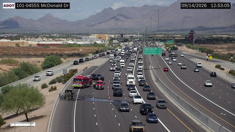 Fire truck and responders attending to a vehicle fire in the right lane