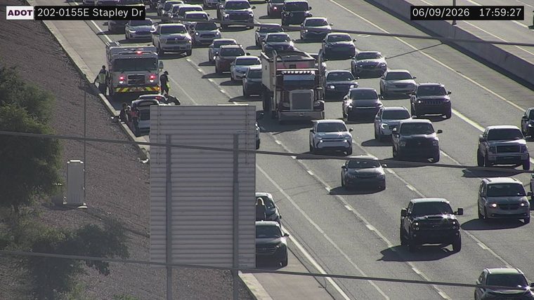 Fire truck and two people on the left shoulder