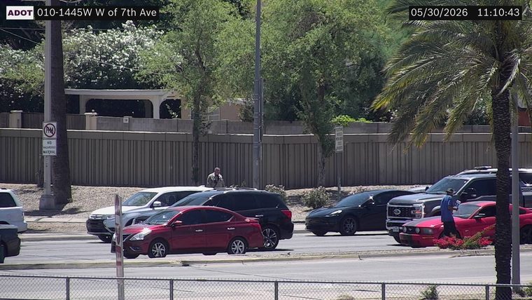 Person standing on the roadway