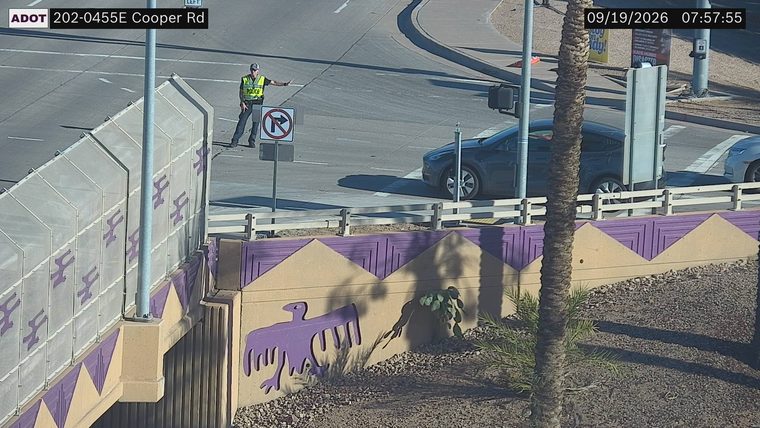 Police officer directing traffic at intersection