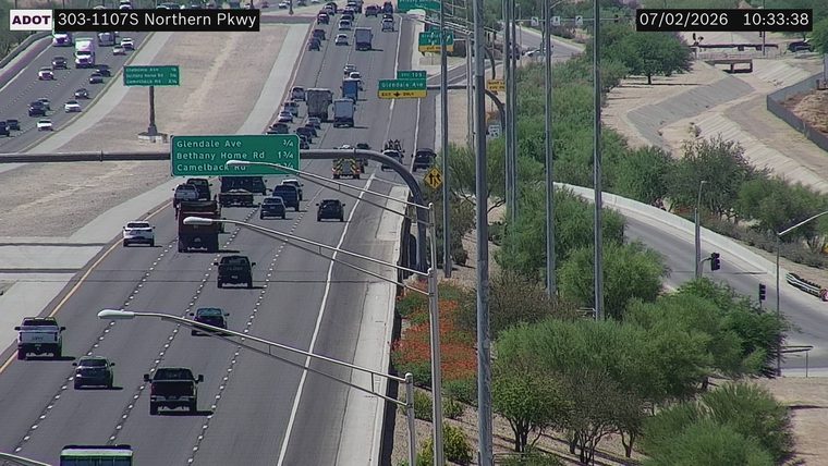 Fire truck with lights on in the left lane
