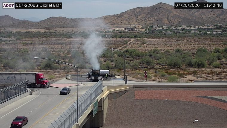 Fire truck and multiple responders at a scene with a damaged truck