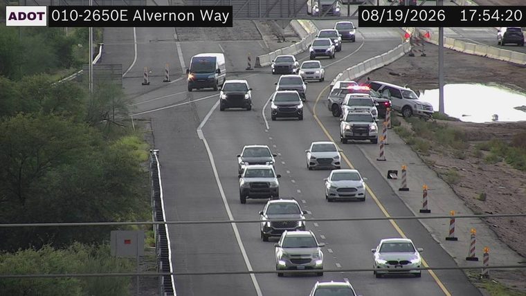 SUV off the roadway with emergency lights visible