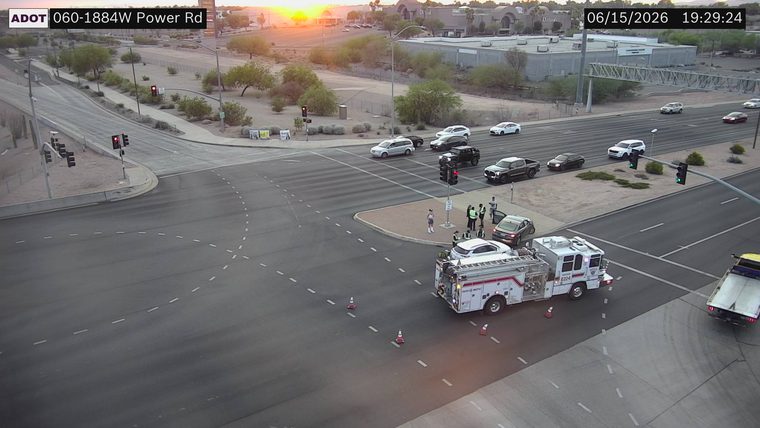 Fire truck and multiple people in the intersection
