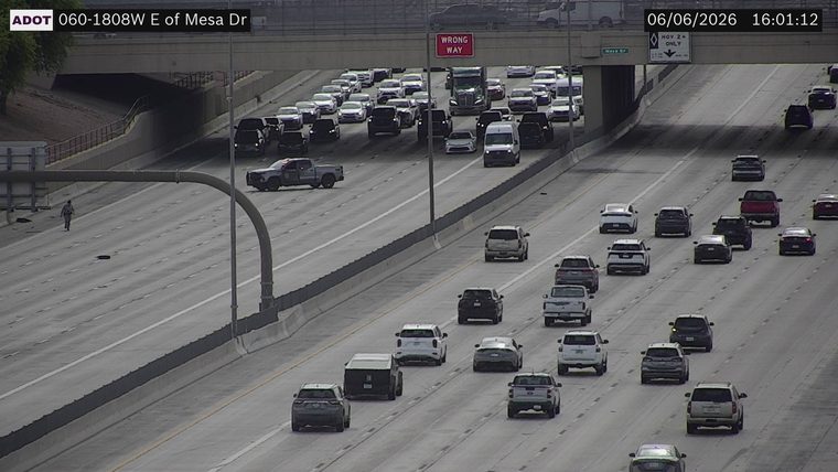 Person walking in the left lanes