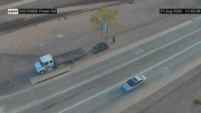 Tow truck on the right shoulder