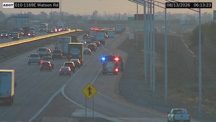 Fire truck with red and blue lights on the right shoulder
