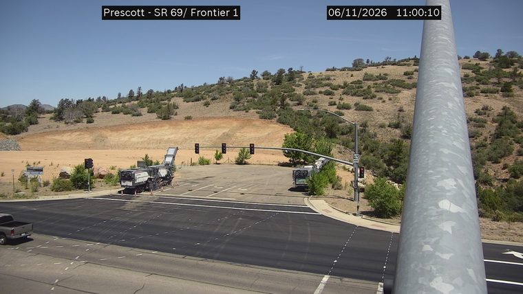 Construction equipment and cones in the right lane