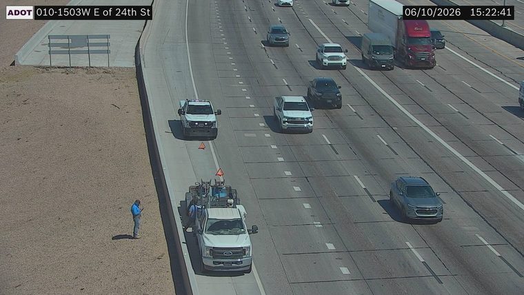 Person standing on the dirt shoulder