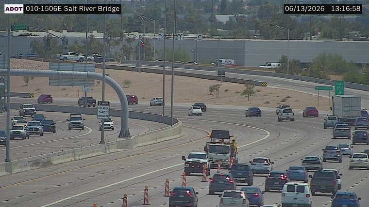 Construction cones and a worker in the right lane