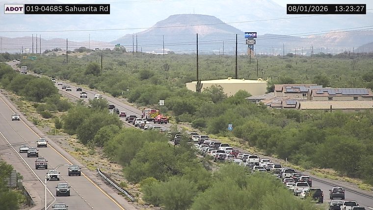 Fire truck and multiple vehicles stopped in the right lane
