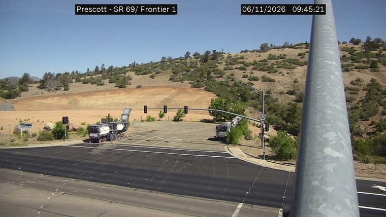 Construction equipment and cones in the roadway
