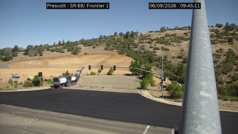 Construction equipment and cones on the roadway