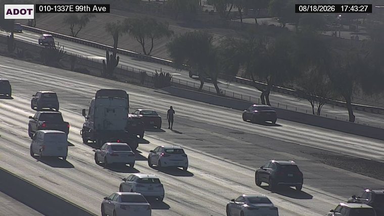 Person in the roadway between lanes