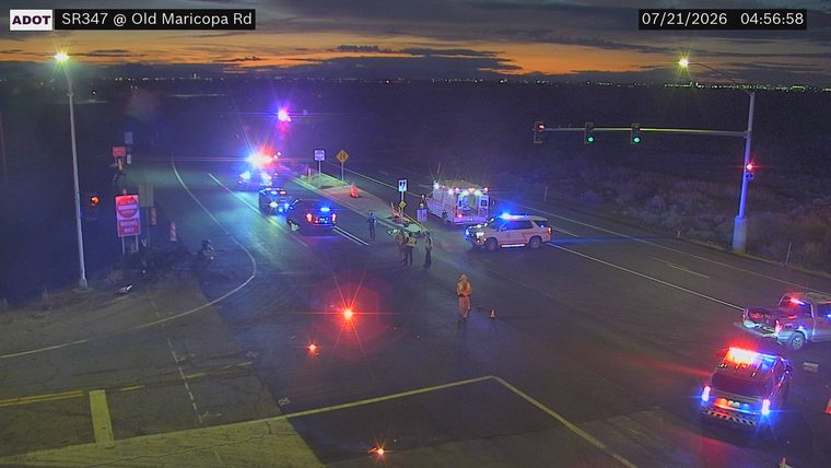 Multiple emergency vehicles and personnel at an intersection
