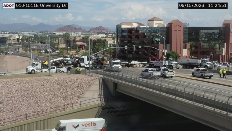 Multiple vehicles involved in a collision with at least one truck overturned in the roadway