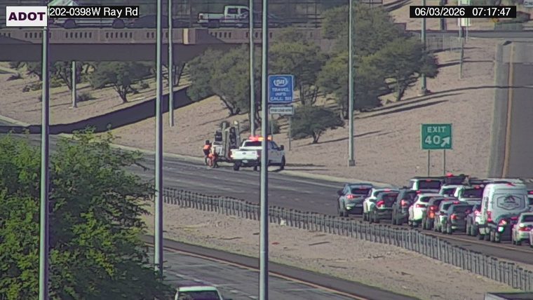 Tow truck and worker on the right shoulder