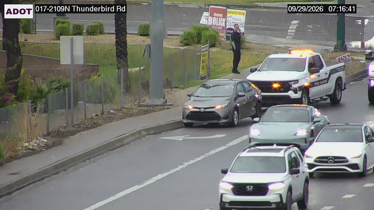 Police Assistance vehicle with amber lights on the right shoulder