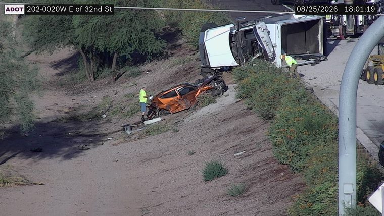 Orange car and white truck crashed off the roadway