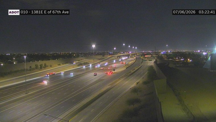 Fire truck with flashing lights on the right shoulder