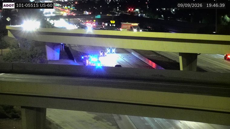 Police car with blue and red lights on the roadway