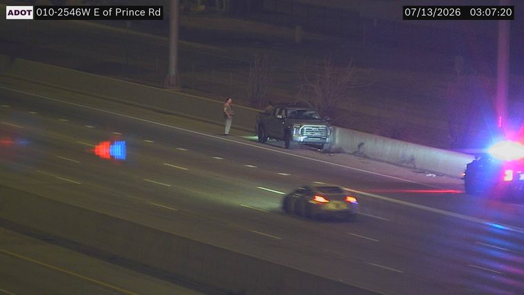 Fire truck and police car with lights on the shoulder