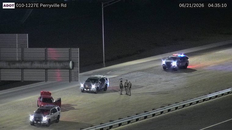 Police car with red and blue lights on the roadway
