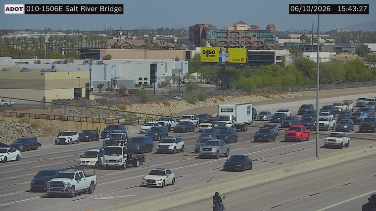 Police car and another vehicle stopped in the right lane