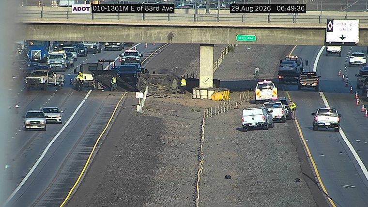 Overturned vehicle in the median with responders present