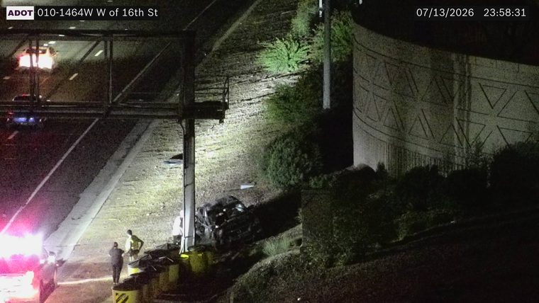 Vehicle off the roadway with responders present