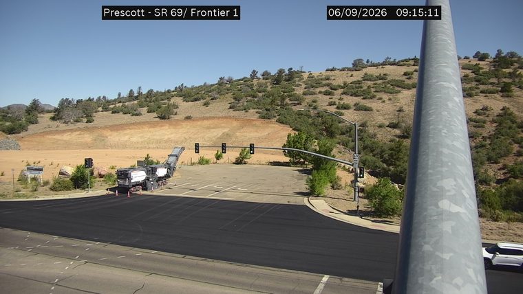 Construction equipment and cones on the roadway