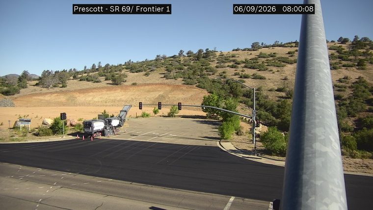 Construction equipment and cones in the roadway