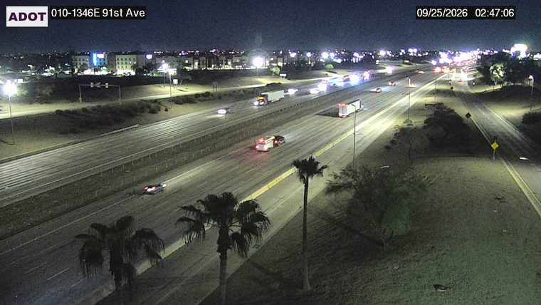 Vehicle with flashing red and blue lights on the right shoulder