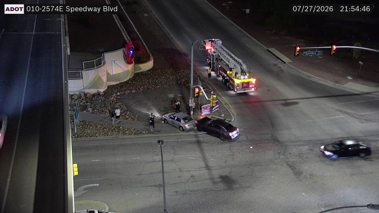 Two vehicles collided in the intersection, with a fire truck present